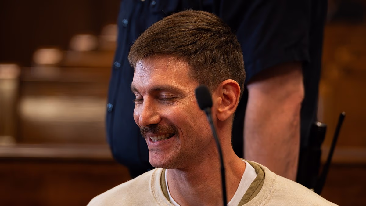 Grinning model accused of murdering husband shows off new facial hair