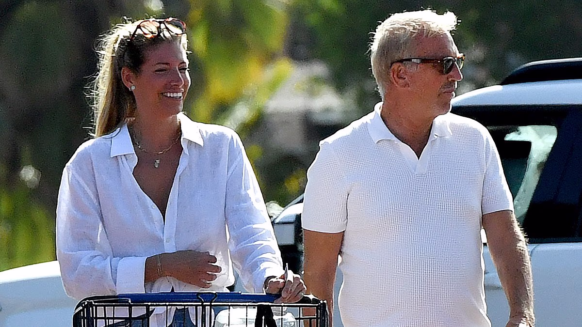 Kevin Costner's 'affectionate' mystery blonde companion UNMASKED