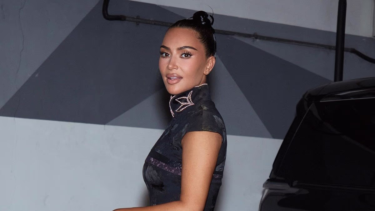 Kim Kardashian shows off her figure in a little black dress