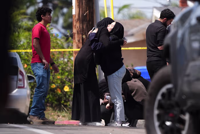 Parents of San Diego mosque gunman say a mental health facility failed to heed FBI warning