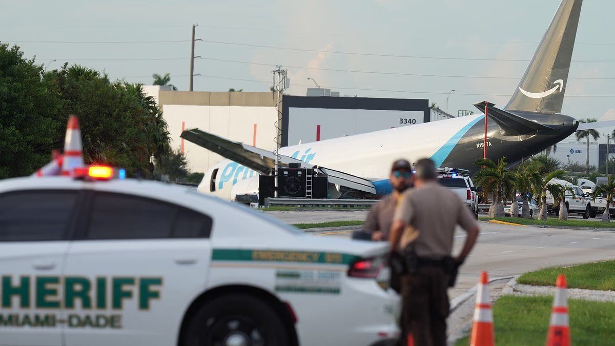 Rescue crews seen climbing into cargo plane that overshot runway