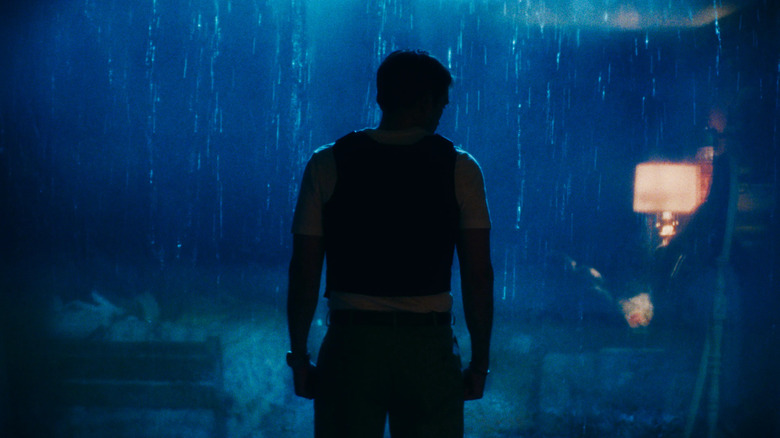 Chris Hansen in silhouette, standing in the rain in Primetime (2026)