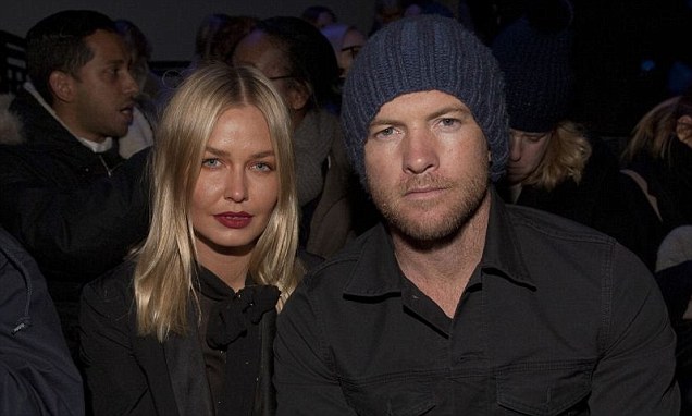 Sam Worthington and Lara Bingle barely raise a smile at Fashion Week