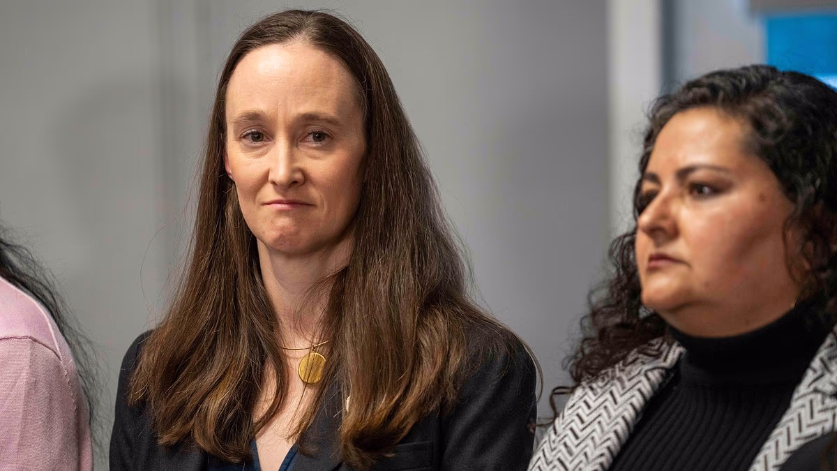 Seattle Mayor Katie Wilson walks stony-faced after being confronted