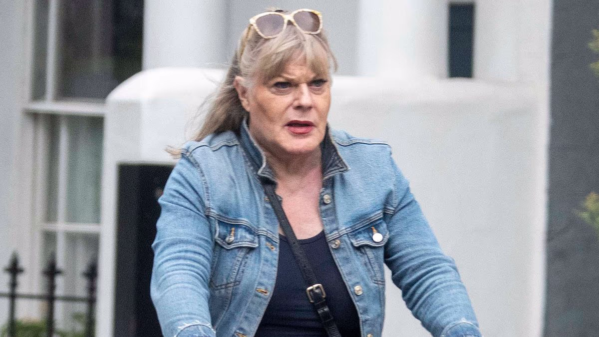 Suzy Eddie Izzard sports a mini-skirt and towering knee-high boots