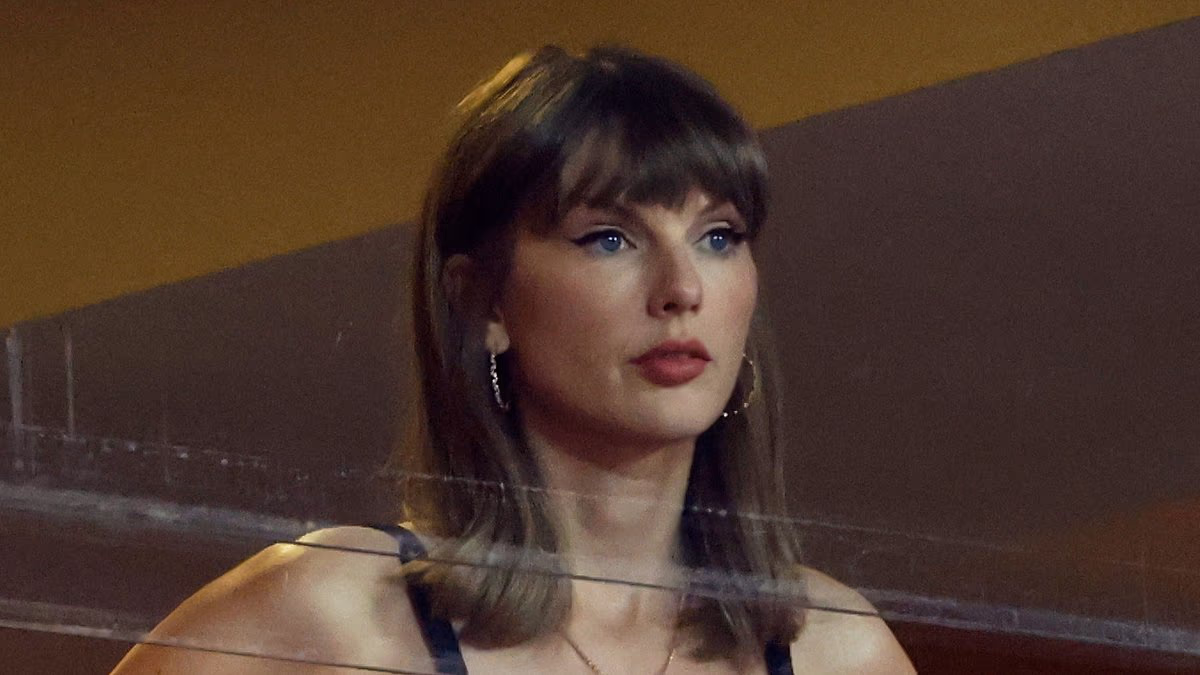 Taylor Swift goes full WAG in Chiefs tank top as she cheers on Travis