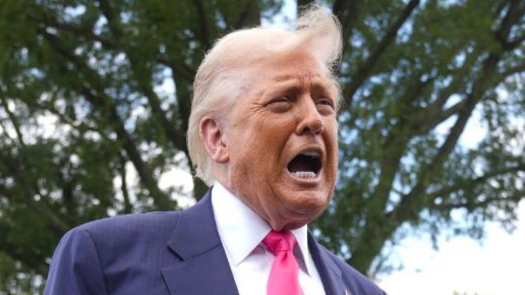President Donald Trump speaks to the media as he leaves the White House, Tuesday, July 15, 2025, in Washington, as White House press secretary Karoline Leavitt, looks on (AP Photo/Manuel Balce Ceneta).
