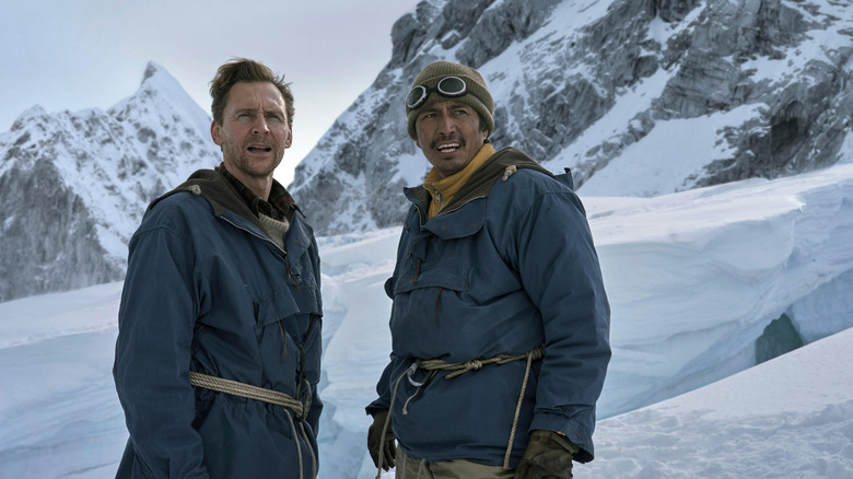 Edmund and Tenzing standing on Everest in