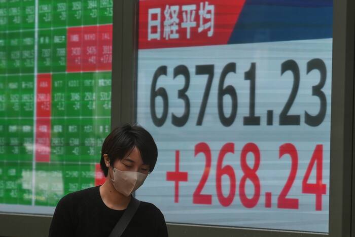 Asian shares are higher as easing worries over inflation reduce odds for another Fed rate hike