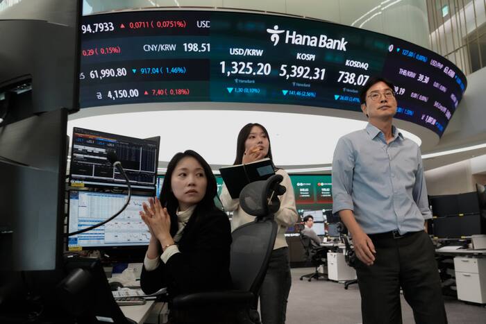 Asian shares slip as sharp drops for AI stocks overwhelm markets worldwide and oil prices jump