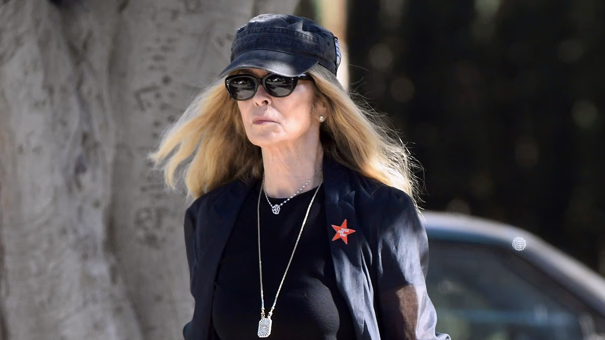 Bond girl wed to '60s icon seen on rare outing... can you guess who?