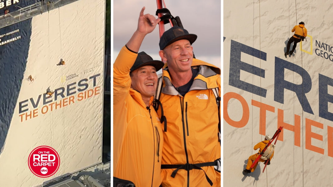 Jimmy Chin and Jim Morrison rappel down an 'Everest: The Other Side' billboard in celebratory stunt