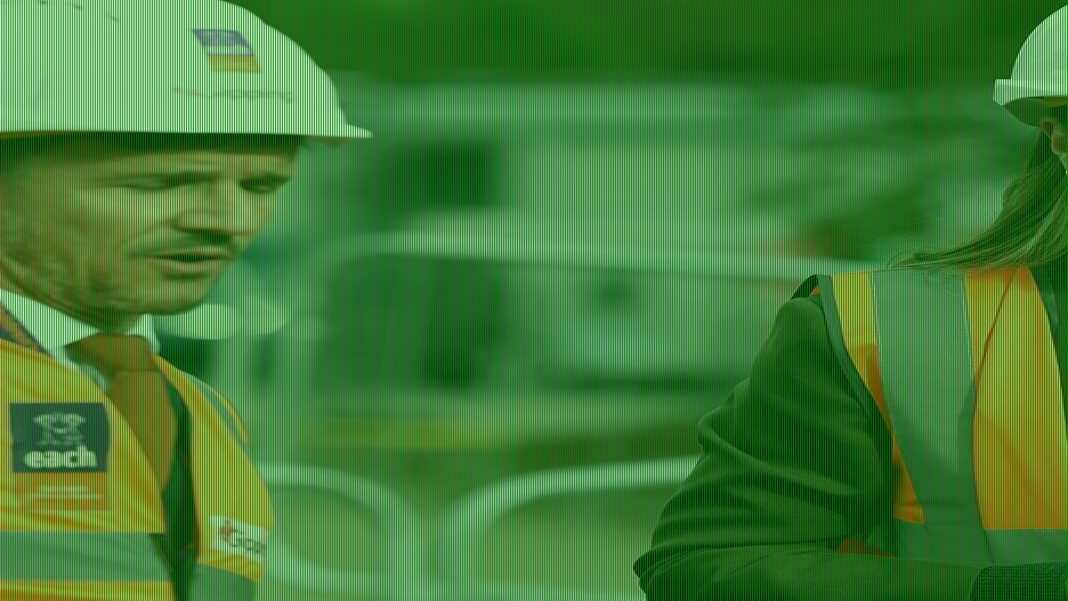 Kate teams hard hat with Victoria Beckham suit at children's hospice