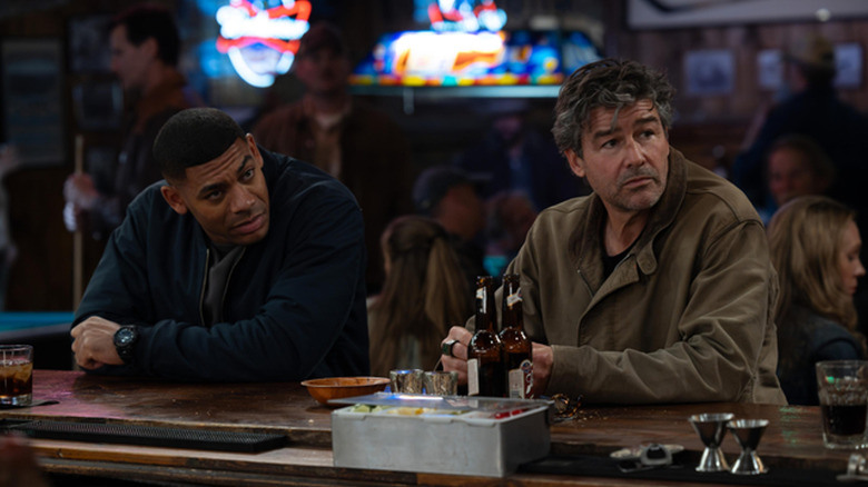 John Stewart and Hal Jordan sitting at a bar in