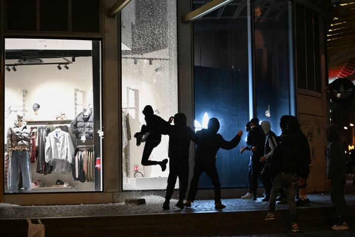 Macron rejects interior minister’s resignation as rioting and looting expose policing failures