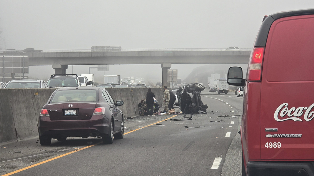 Woman allegedly stabs girl after SUV hits semi as soldiers step in to stop horrific roadside attack